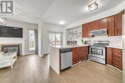 38 Lundigan Drive, Georgina (Keswick South), ON - Indoor Photo Showing Kitchen With Fireplace