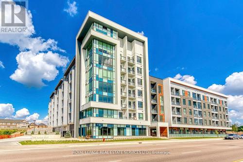 216 - 95 Dundas Street W, Oakville, ON - Outdoor With Facade