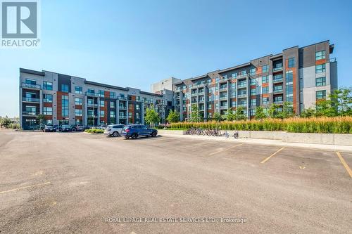 216 - 95 Dundas Street W, Oakville, ON - Outdoor With Facade