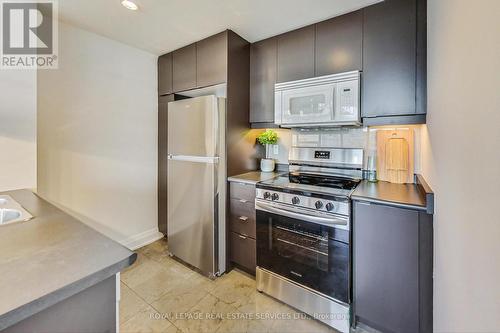 705 - 383 Ellis Park Road, Toronto, ON - Indoor Photo Showing Kitchen