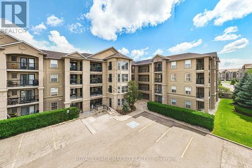 212 - 1491 Maple Avenue, Milton (Dempsey), ON - Outdoor With Balcony With Facade