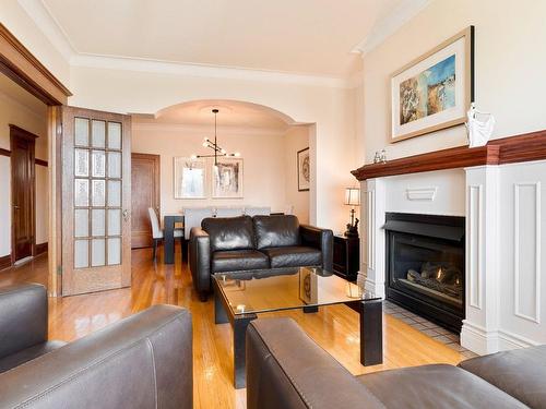 Living room - 3811 Rue Botrel, Montréal (Côte-Des-Neiges/Notre-Dame-De-Grâce), QC - Indoor Photo Showing Living Room With Fireplace