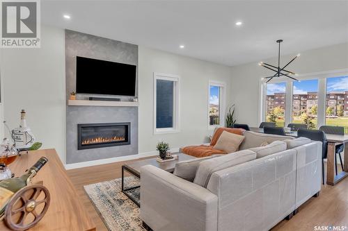 5217 E Green Crescent, Regina, SK - Indoor Photo Showing Living Room With Fireplace