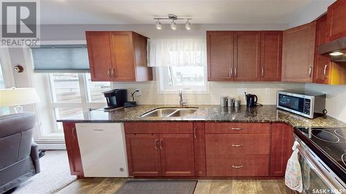 211 2311 Windsor Park Road, Regina, SK - Indoor Photo Showing Kitchen With Double Sink