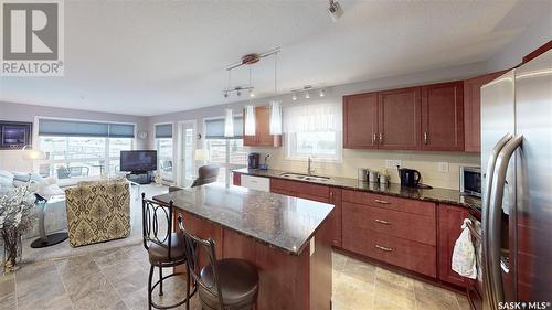 211 2311 Windsor Park Road, Regina, SK - Indoor Photo Showing Kitchen With Double Sink