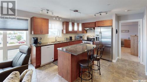 211 2311 Windsor Park Road, Regina, SK - Indoor Photo Showing Kitchen With Double Sink