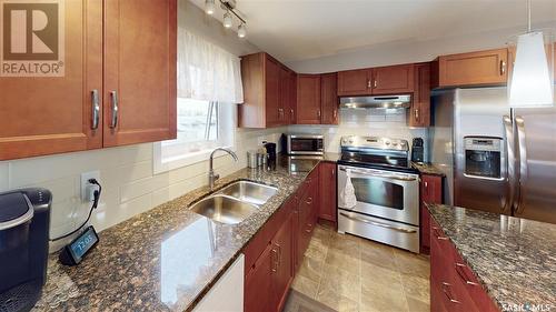 211 2311 Windsor Park Road, Regina, SK - Indoor Photo Showing Kitchen With Double Sink