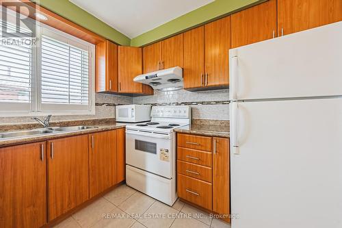 9 Tamarisk Drive, Toronto (West Humber-Clairville), ON - Indoor Photo Showing Kitchen With Double Sink