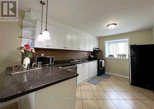 18 - 164 Moregate Crescent, Brampton, ON - Indoor Photo Showing Kitchen With Double Sink