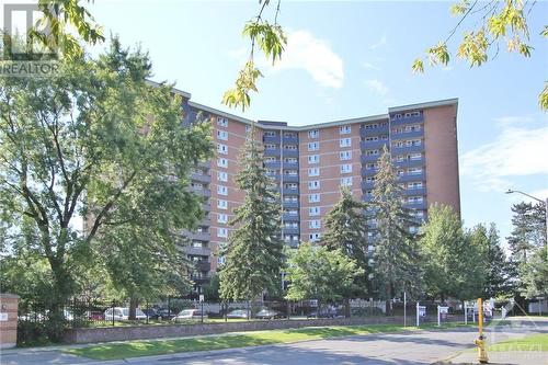 Welcome to Sutton Place at 2000 Jasmine Crescent with Ample Visitor Parking in Front - 2000 Jasmine Crescent Unit#1208, Ottawa, ON - Outdoor With Balcony