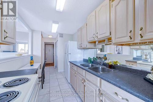 Ph112 - 90 Ling Road, Toronto (West Hill), ON - Indoor Photo Showing Kitchen With Double Sink