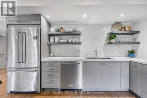 80 Links Trail, Georgian Bay, ON - Indoor Photo Showing Kitchen With Stainless Steel Kitchen With Double Sink