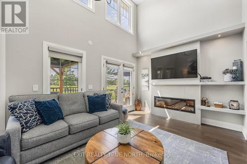 80 Links Trail, Georgian Bay, ON - Indoor Photo Showing Living Room With Fireplace