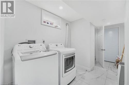 Basement Laundry Room - 18 Curtis Street, Breslau, ON - Indoor Photo Showing Laundry Room