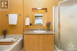 Second floor bathroom with large soaker tub and walk in shower - 