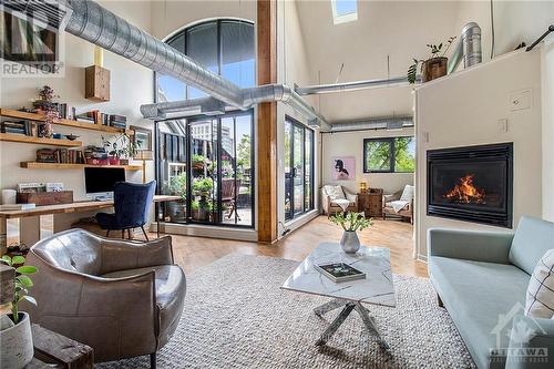 303 - 95 Beech Street, Ottawa, ON - Indoor Photo Showing Living Room With Fireplace