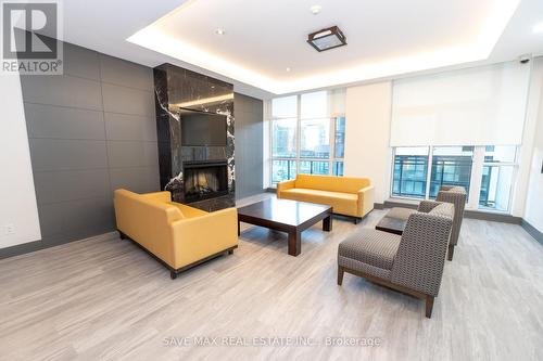 2908 - 4070 Confederation Parkway, Mississauga, ON - Indoor Photo Showing Living Room With Fireplace