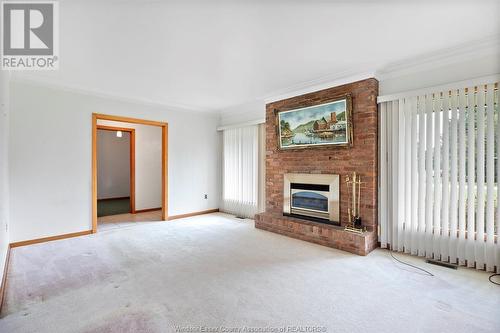 4033 Howard, Windsor, ON - Indoor Photo Showing Living Room With Fireplace