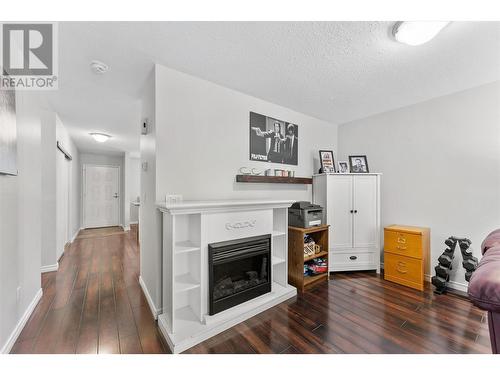 3020 Allenby Way Unit# 211, Vernon, BC - Indoor Photo Showing Other Room With Fireplace