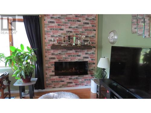 213 Baker Drive, Quesnel, BC - Indoor Photo Showing Living Room With Fireplace