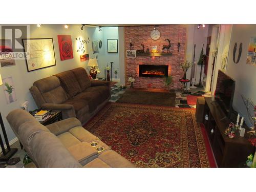 213 Baker Drive, Quesnel, BC - Indoor Photo Showing Living Room With Fireplace