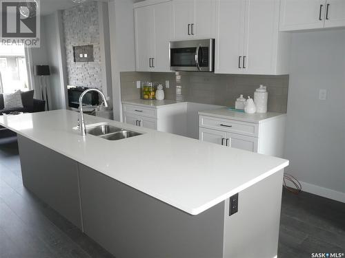 321 Brighton Boulevard, Saskatoon, SK - Indoor Photo Showing Kitchen With Double Sink With Upgraded Kitchen