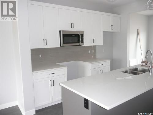 321 Brighton Boulevard, Saskatoon, SK - Indoor Photo Showing Kitchen With Double Sink