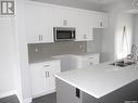 321 Brighton Boulevard, Saskatoon, SK  - Indoor Photo Showing Kitchen With Double Sink 