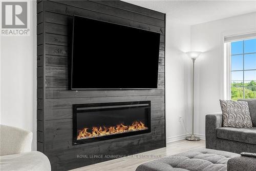 4152 Roger Stevens Drive, Montague, ON - Indoor Photo Showing Living Room With Fireplace