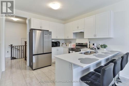 2173 Grainger Loop, Innisfil, ON - Indoor Photo Showing Kitchen With Double Sink