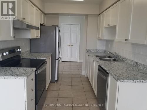 1525 - 25 Kingsbridge Garden Circle, Mississauga, ON - Indoor Photo Showing Kitchen With Double Sink