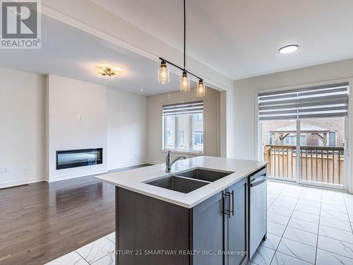 41 Cobriza Crescent, Brampton (Northwest Brampton), ON - Indoor Photo Showing Kitchen With Fireplace With Double Sink