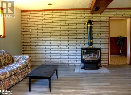 Lower Level Family Room - 3410 Reservoir Road, Coldwater, ON - Indoor Photo Showing Living Room With Fireplace