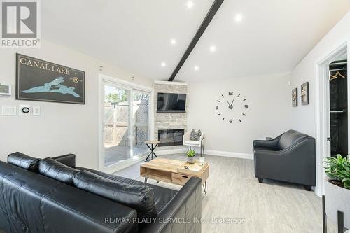 28 Eldonia Road, Kawartha Lakes, ON - Indoor Photo Showing Living Room With Fireplace