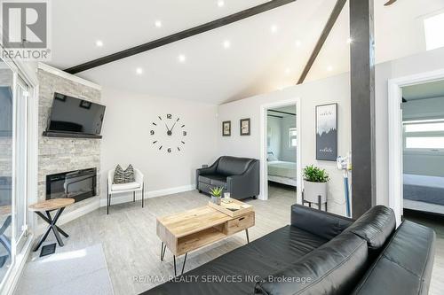 28 Eldonia Road, Kawartha Lakes, ON - Indoor Photo Showing Living Room With Fireplace