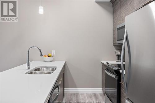 11870 Tecumseh Road East Unit# 510, Tecumseh, ON - Indoor Photo Showing Kitchen With Stainless Steel Kitchen With Double Sink