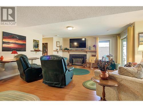 4074 Gellatly Road Unit# 126, West Kelowna, BC - Indoor Photo Showing Living Room With Fireplace