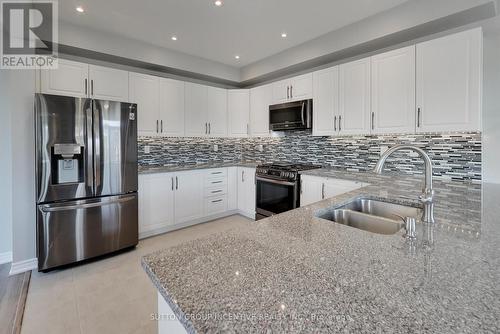 24 Sasco Way, Essa, ON - Indoor Photo Showing Kitchen With Stainless Steel Kitchen With Double Sink With Upgraded Kitchen