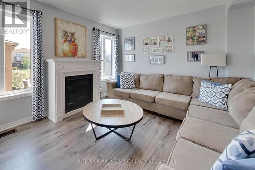 24 Sasco Way, Essa, ON - Indoor Photo Showing Living Room With Fireplace