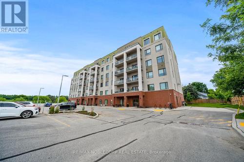 201 - 64 Queen Street S, New Tecumseth (Tottenham), ON - Outdoor With Balcony With Facade