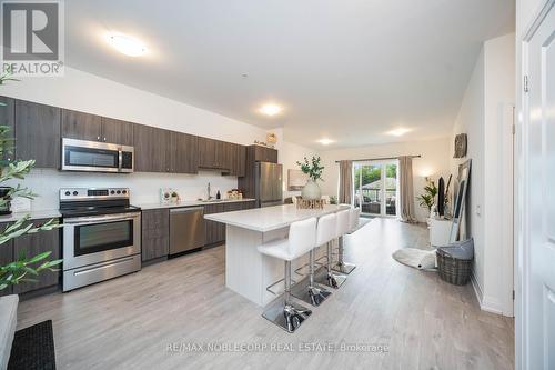 201 - 64 Queen Street S, New Tecumseth (Tottenham), ON - Indoor Photo Showing Kitchen With Upgraded Kitchen