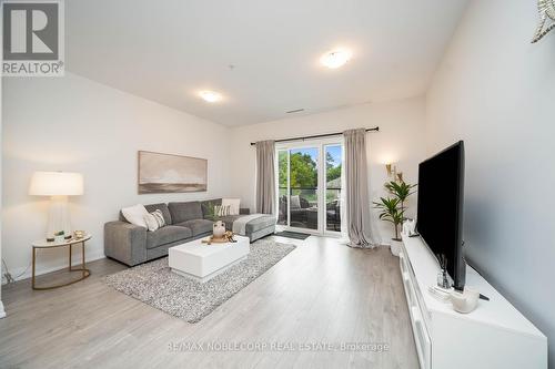 201 - 64 Queen Street S, New Tecumseth (Tottenham), ON - Indoor Photo Showing Living Room