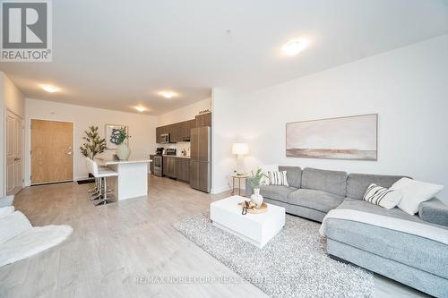 201 - 64 Queen Street S, New Tecumseth (Tottenham), ON - Indoor Photo Showing Living Room