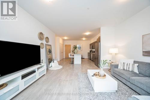 201 - 64 Queen Street S, New Tecumseth (Tottenham), ON - Indoor Photo Showing Living Room