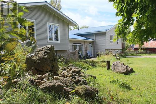 Front view of house with a lawn - 208 Pellisier Street, Eugenia, ON - Outdoor