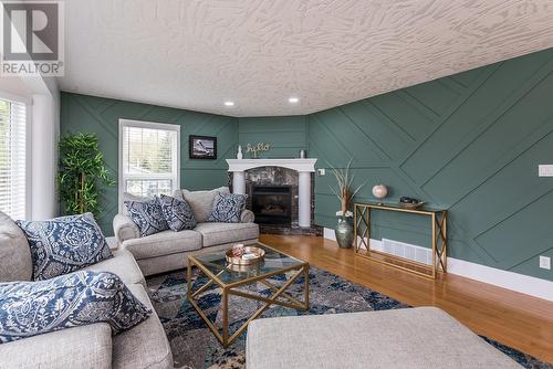 8219 St Patrick Avenue, Prince George, BC - Indoor Photo Showing Living Room With Fireplace