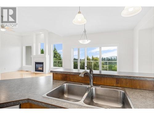 2567 Rhinestone Road, West Kelowna, BC - Indoor Photo Showing Kitchen With Fireplace With Double Sink