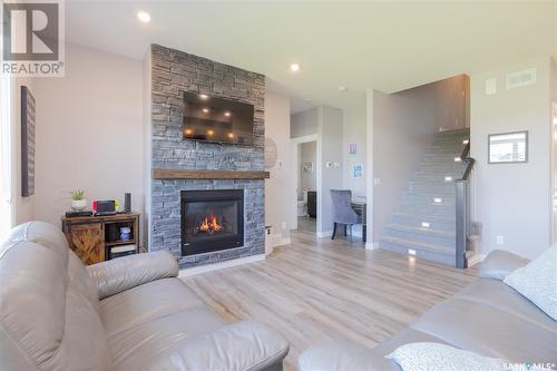 284 Cowan Crescent, Martensville, SK - Indoor Photo Showing Living Room With Fireplace