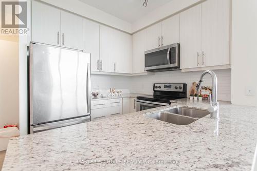 1407 - 3975 Grand Park Drive, Mississauga (City Centre), ON - Indoor Photo Showing Kitchen With Stainless Steel Kitchen With Double Sink With Upgraded Kitchen