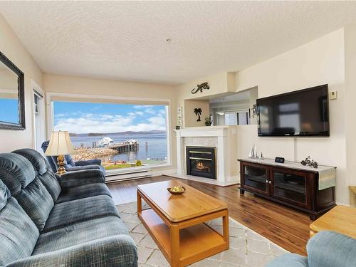 302-2550 Bevan Ave, Sidney, BC - Indoor Photo Showing Living Room With Fireplace